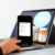 Smartphone screen displaying a prescription transfer process with medication bottles and a pharmacy symbol in the background, highlighting convenie...
