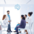 Healthcare professionals discussing mental health treatment with a patient in a bright clinic, with subtle brain chemistry symbols in the background.