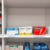 Pharmacy shelf with neatly arranged generic and brand-name medication boxes side by side, clear labels highlighting "Generic" and "Brand-Name" for ...
