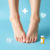 Close-up of feet gently touching, surrounded by subtle medical symbols on a soft blue background, conveying healthcare and comfort.